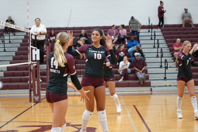 Flour Bluff's Nya White high fives Emily Eggleston