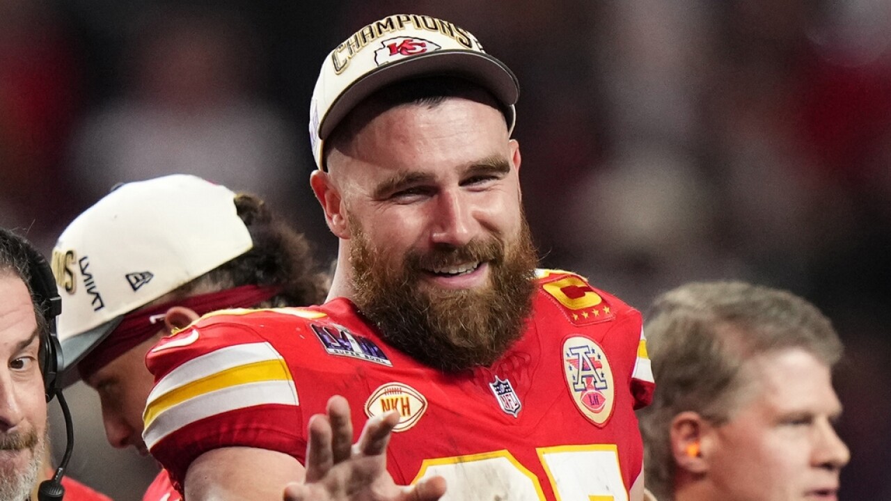 Kansas City Chiefs tight end Travis Kelce waves.