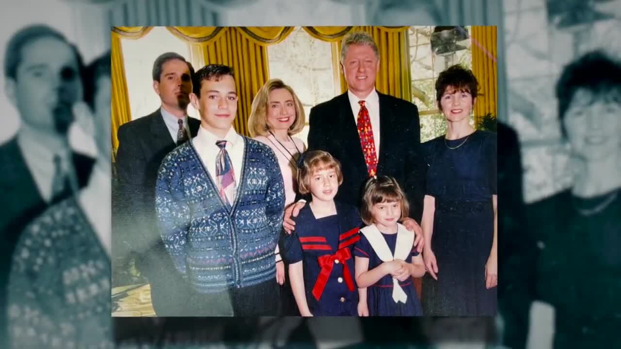 Photo of Secret Service agent Tim Miller and family with President Bill Clinton in Oval Office