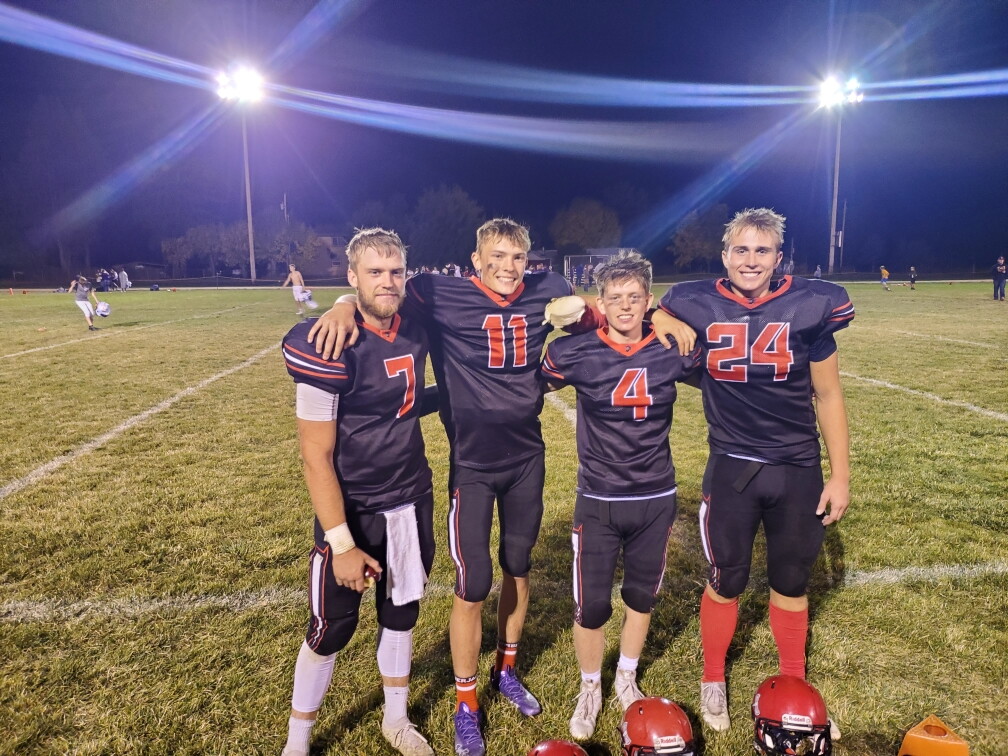 Wyatt Vining (far right) at a high school football game