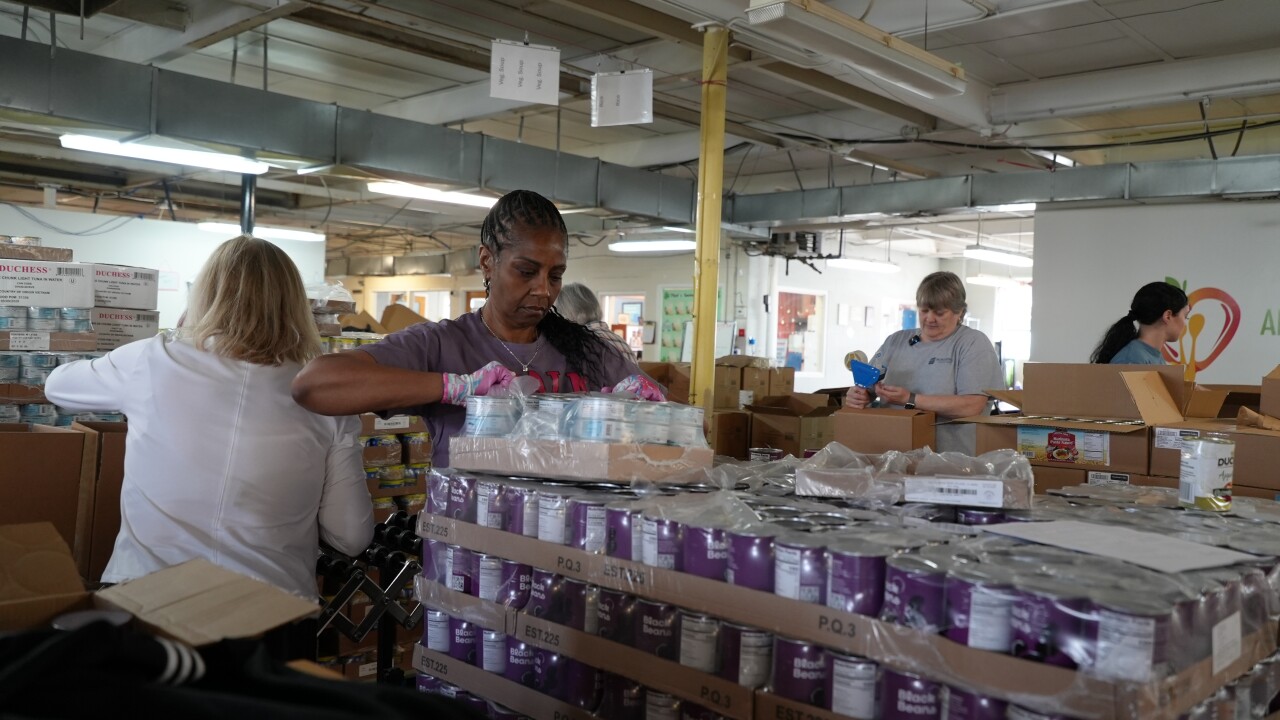 Volunteers filling boxes at the Anne Arundel County Food Bank