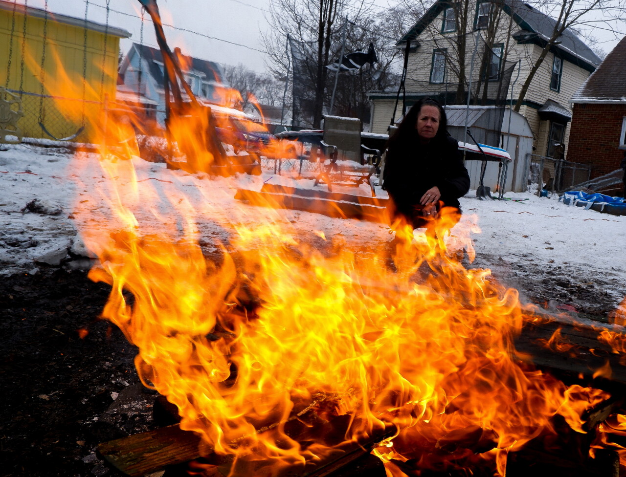 Virginia LaForce watches the bonfire grow in her Kenmore backyard. (Noor Hindi_The Devil Strip).jpeg