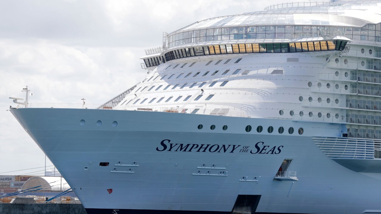 The Symphony of the Seas cruise ship is shown docked at PortMiami, in a Wednesday, May 20, 2020, file photo, in Miami.