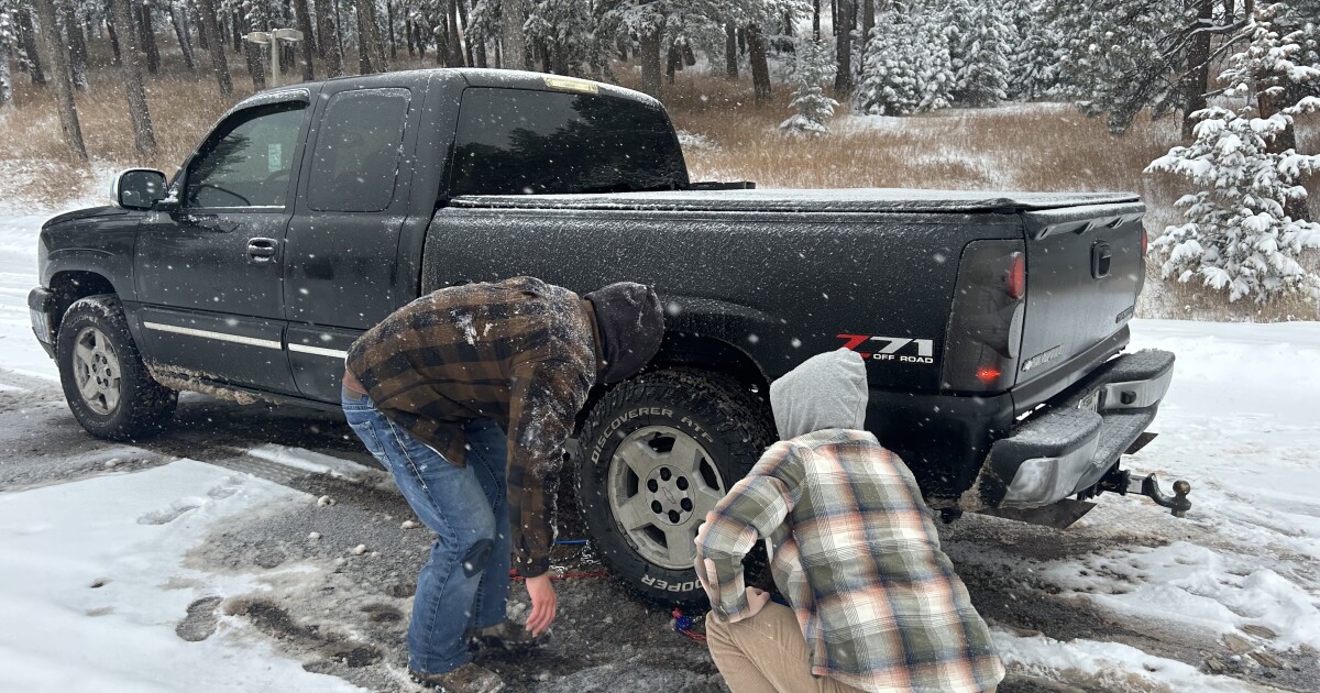 Colorado drivers struggle with chaining up along I-70 during winter storms, despite a new law meant to help