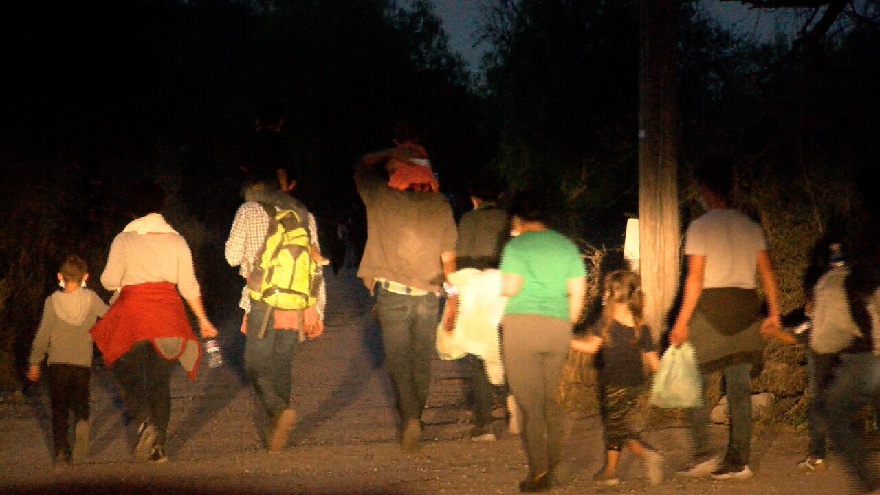 migrants walking at night.jpg