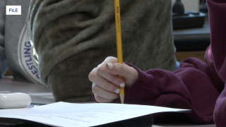 kid with pencil.png