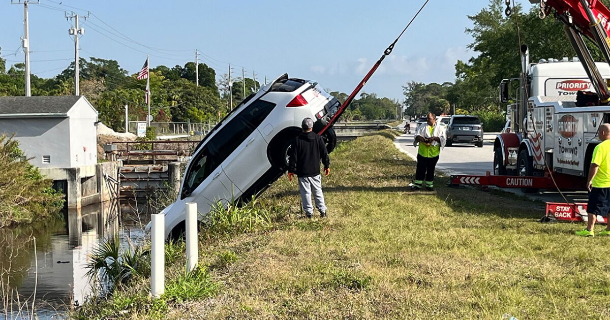 2 people rescued after SUV plunges into canal