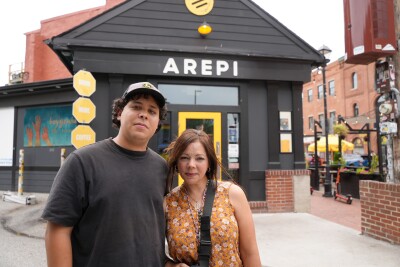 Luis Dams and his mother at their family restaurant, Arepi