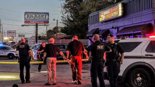 Tulsa police shot an armed suspect Thursday night after he followed a shooting victim inside a restaurant near 51st and Peoria.