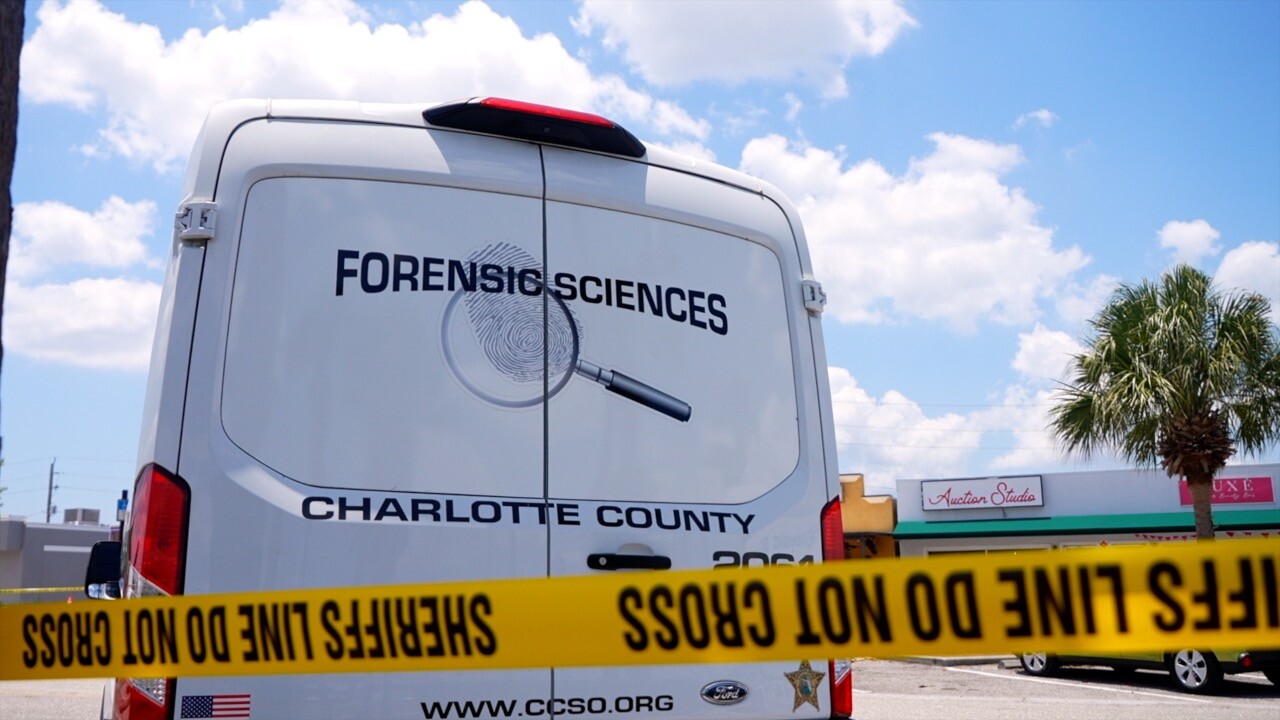 Charlotte County forensic sciences van with yellow police tap blocking off the parking lot in front of Jackpot Zone arcade.