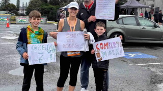 Katie Virtue with her family after completing her 7th and final race on every continent
