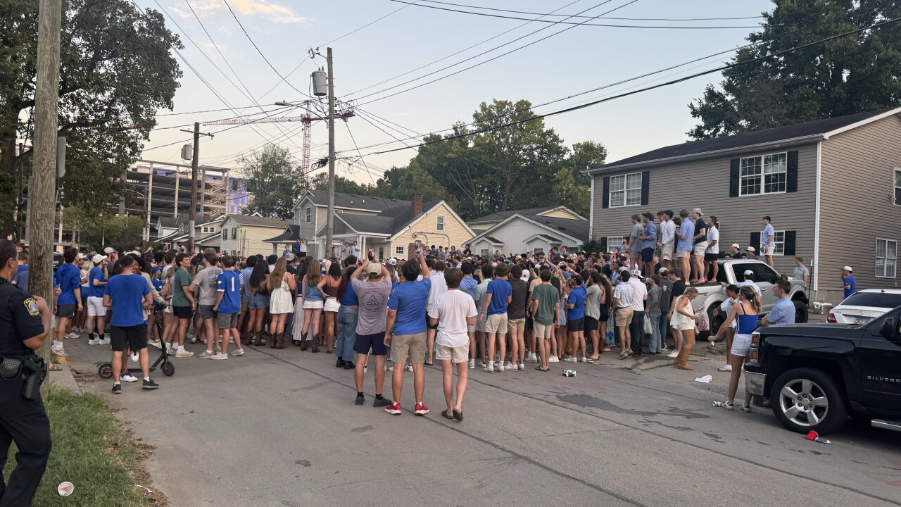 University of Kentucky students and fans swarm State Street for the traditional couch burning