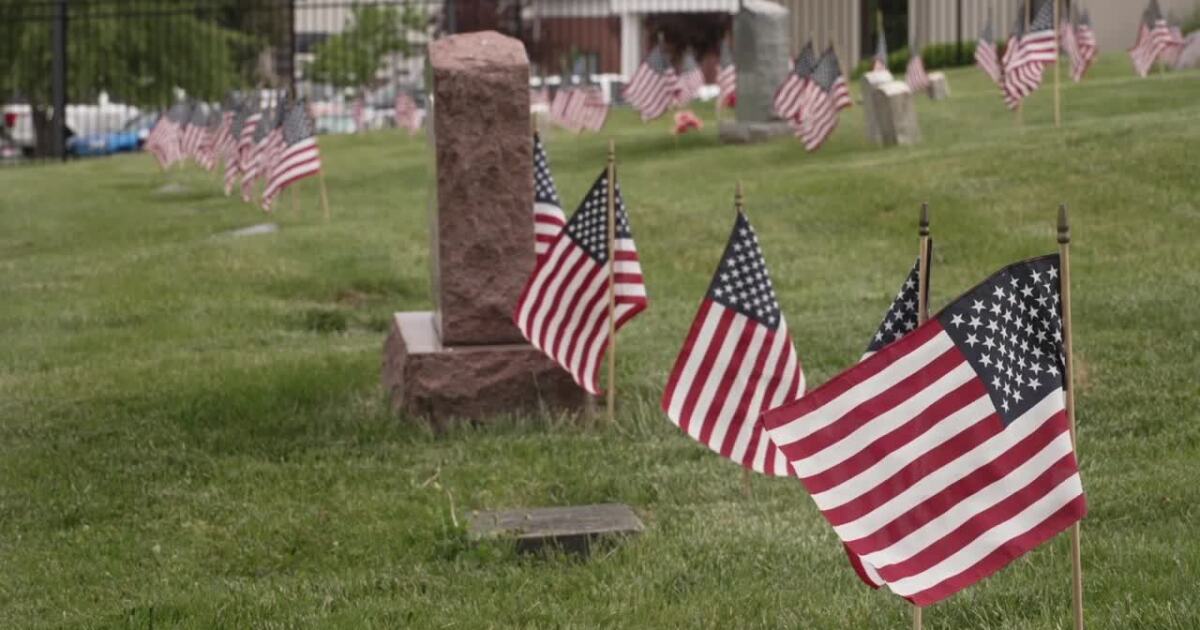 Hundreds of volunteers place nearly 10,000 flags on veterans' gravesites ahead of Memorial Day weekend