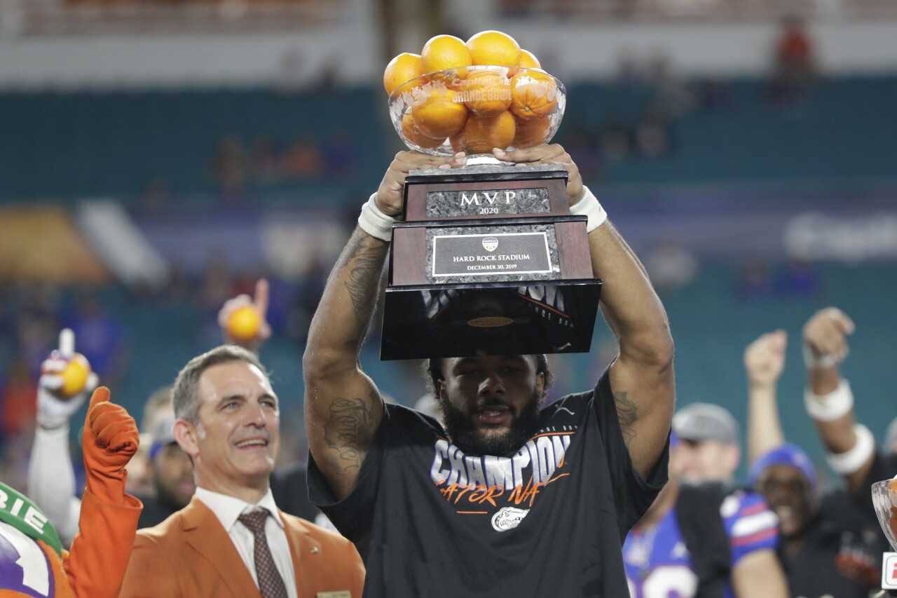 Florida Gators running back La'Mical Perine holds 2019 Orange Bowl MVP trophy