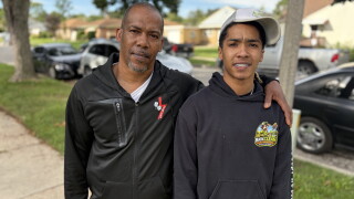 Jomarion Swiams (pictured with Father Jonathan) says starting BarkClean gave him somewhere positive to put his time and energy. Now, the Bradley Tech junior wants to help other teens build opportunities of their own.