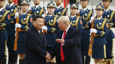 U.S. President Donald Trump takes part in a welcoming ceremony with China's President Xi Jinping on November 9, 2017