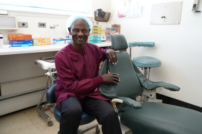 Dr. Richardson by a dental chair