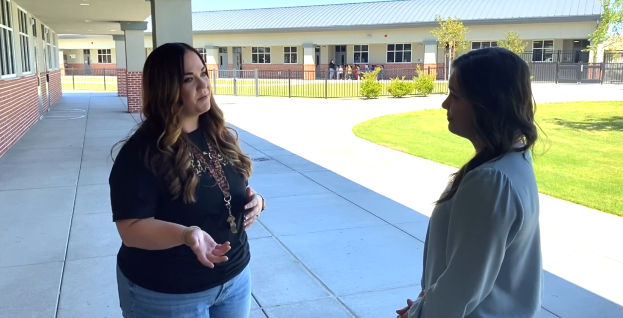 Neighborhood News Reporter Veronica Morley interviewing 2nd Grade Teacher Kristin Ponche about how she prepared her students for the eclipse