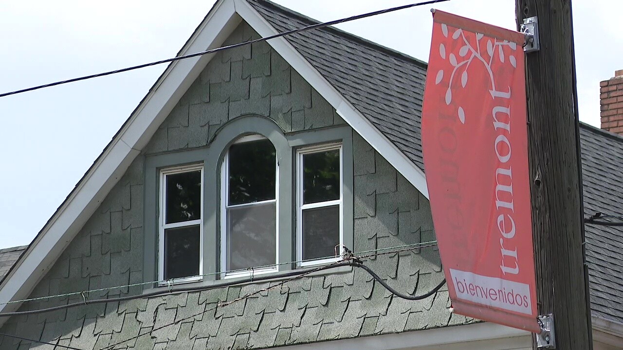 A flag welcomes people to Tremont, the neighborhood where Pete Rivera lives.