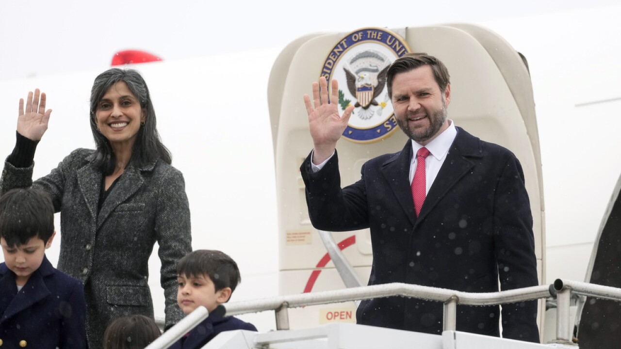 U.S. Vice President JD Vance and second lady Usha Vance, with their children Ewan, Vivek, and Mirabel, wave as they arrive at the Munich airport in Germany.