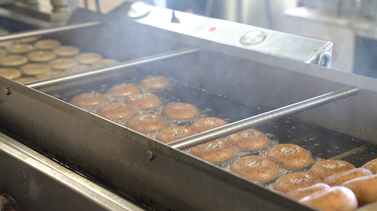 Fresh donuts being made at Uncle John's Cider Mill