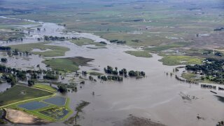 This Saturday, Sept. 14, 2019 photo provided by the South Dakota Civil Air Patrol shows an aerial view of the flooding in Spencer, S.D. Flooding from torrential rain that's soaked much of southeastern South Dakota has closed schools for a second day, submerged city streets and caused some to evacuate their homes. (South Dakota Civil Air Patrol via AP)