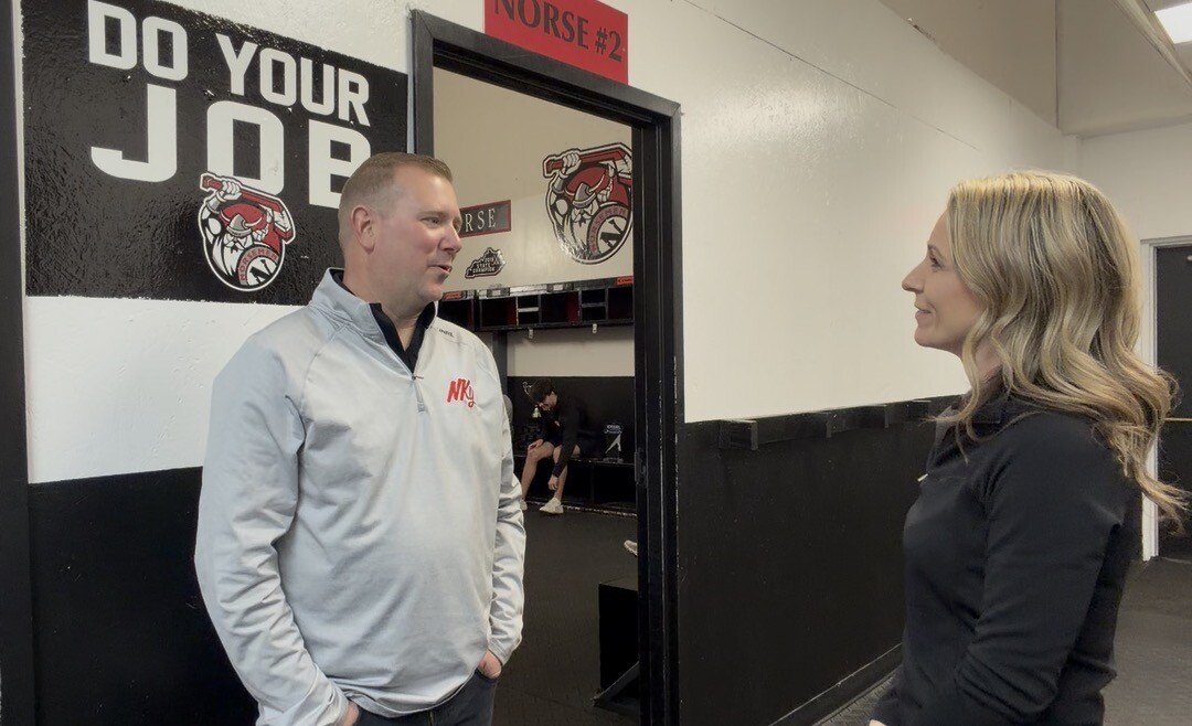 Jen talking to head coach Eric Kathman