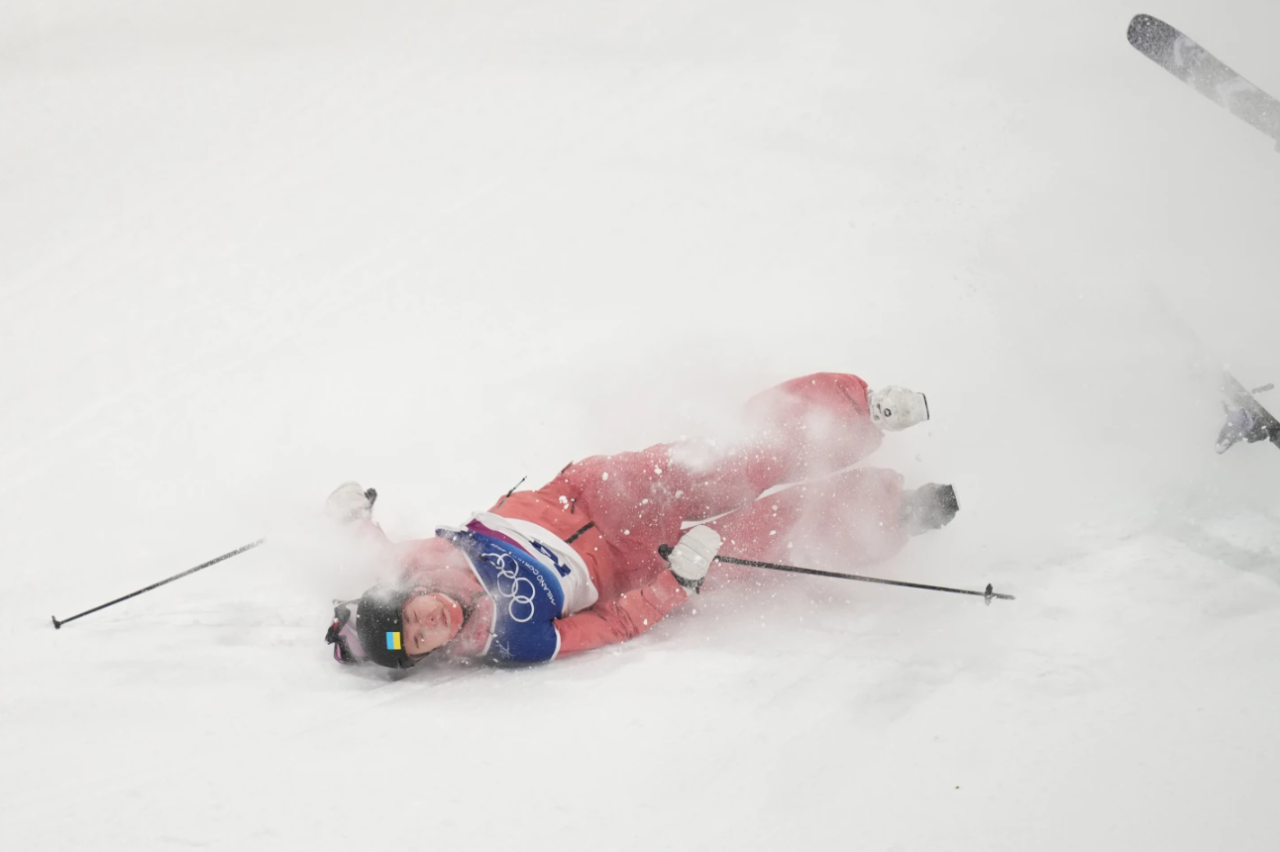 Ukraine's Kateryna Kotsar crashes as she competes in the women's freestyle skiing big air qualifications at the 2026 Winter Olympics, in Livigno, Italy, Saturday, Feb. 14, 2026.