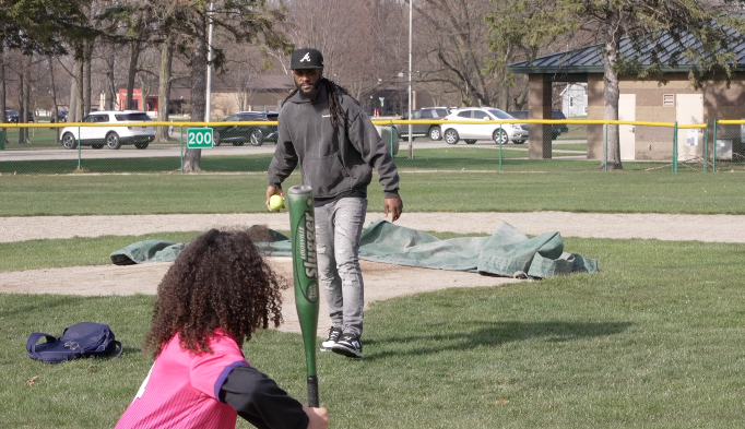Kendell pitching to daughter