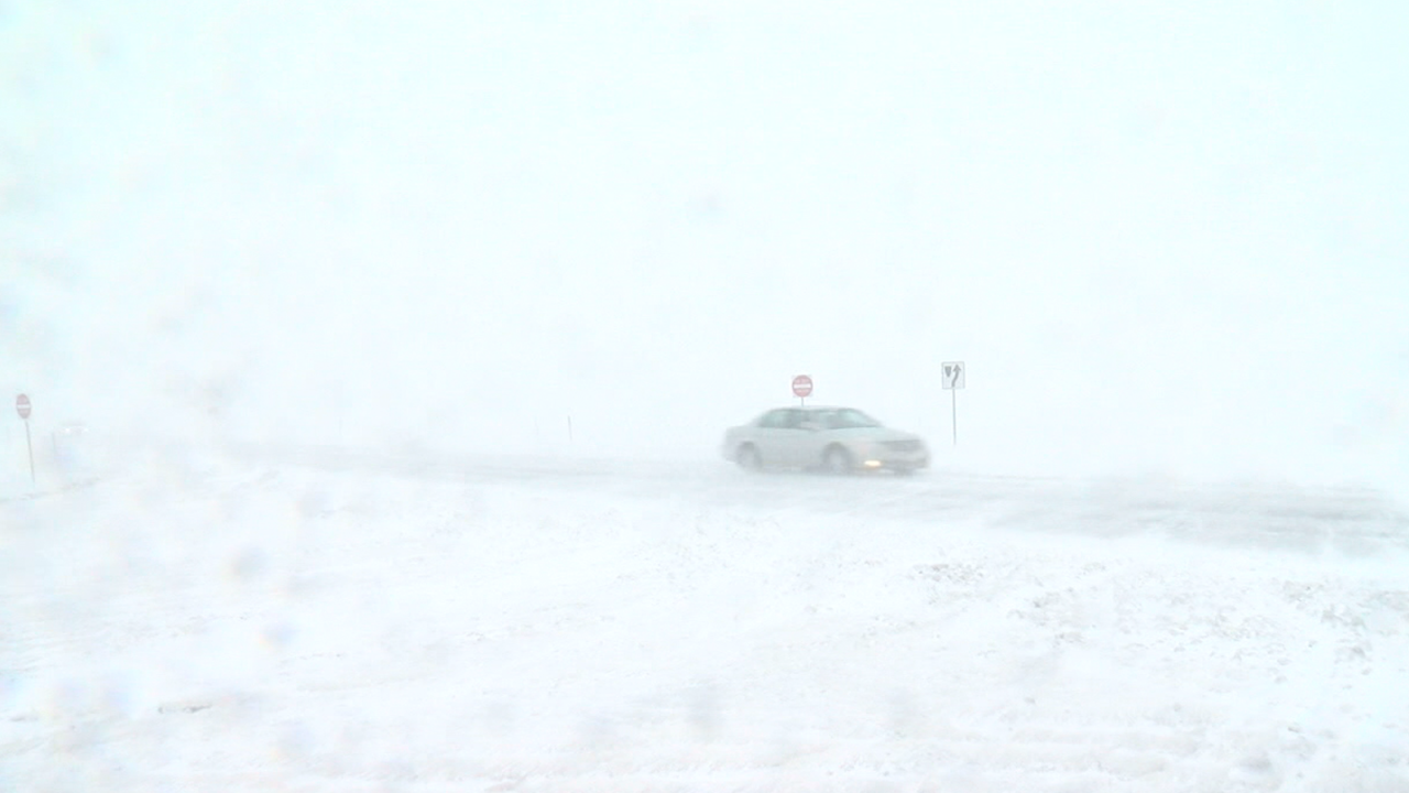 blizzard-car-on-highway.png