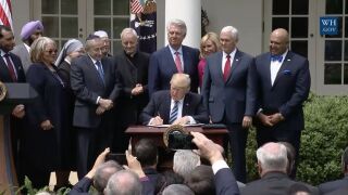 President Trump signs an executive order.