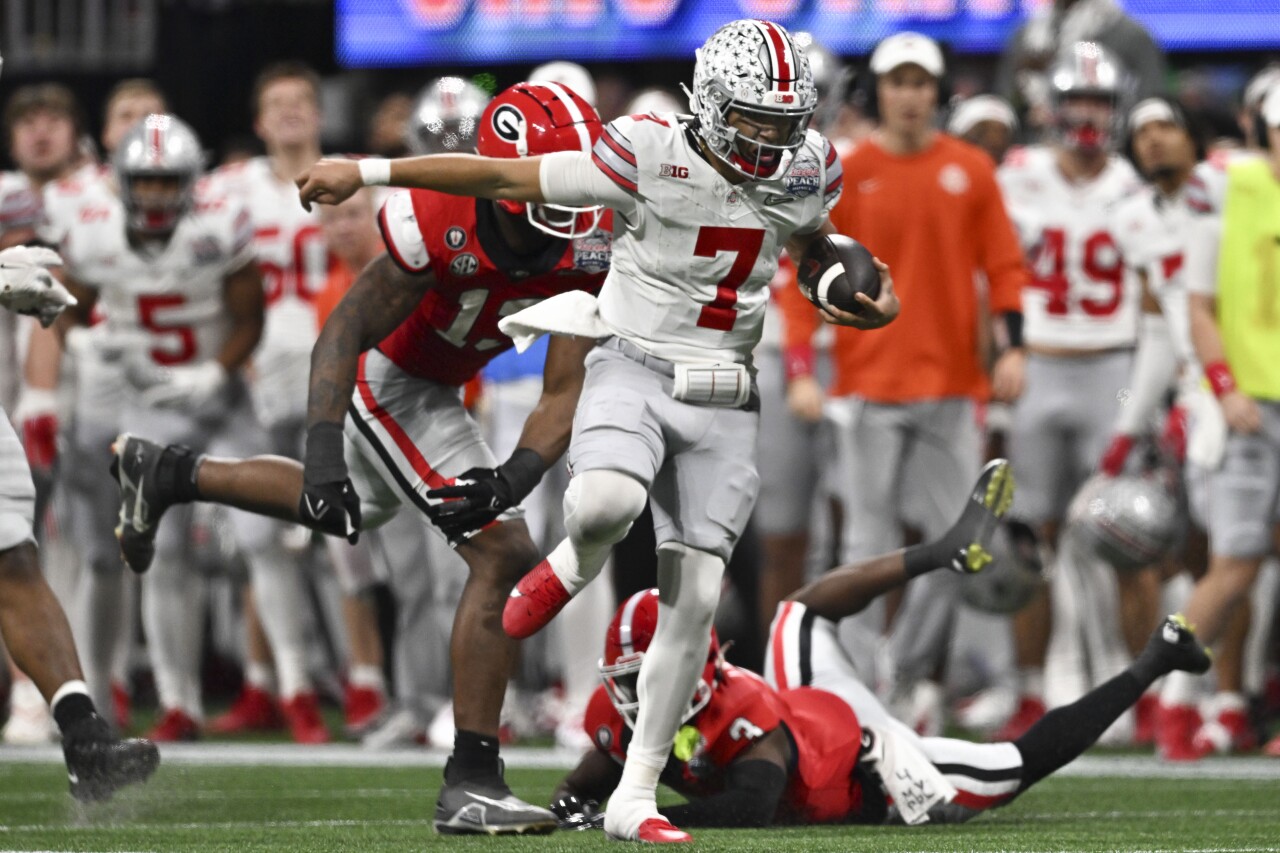 Ohio State Buckeyes QB CJ Stroud runs vs. Georgia Bulldogs in College Football Playoff at Peach Bowl, Dec. 31, 2022