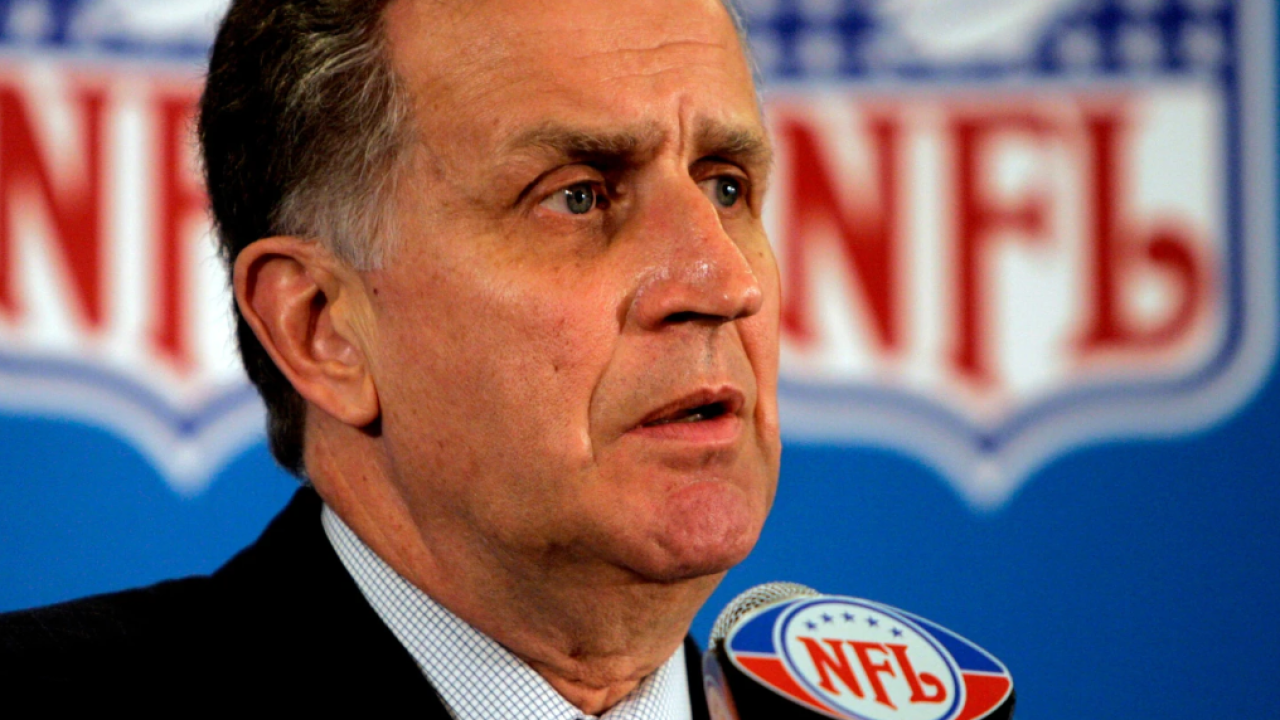 This May 23, 2006, file photo shows then NFL Commissioner Paul Tagliabue responding to questions during a news conference at the conclusion of the National Football League's owners spring meeting in Denver.
