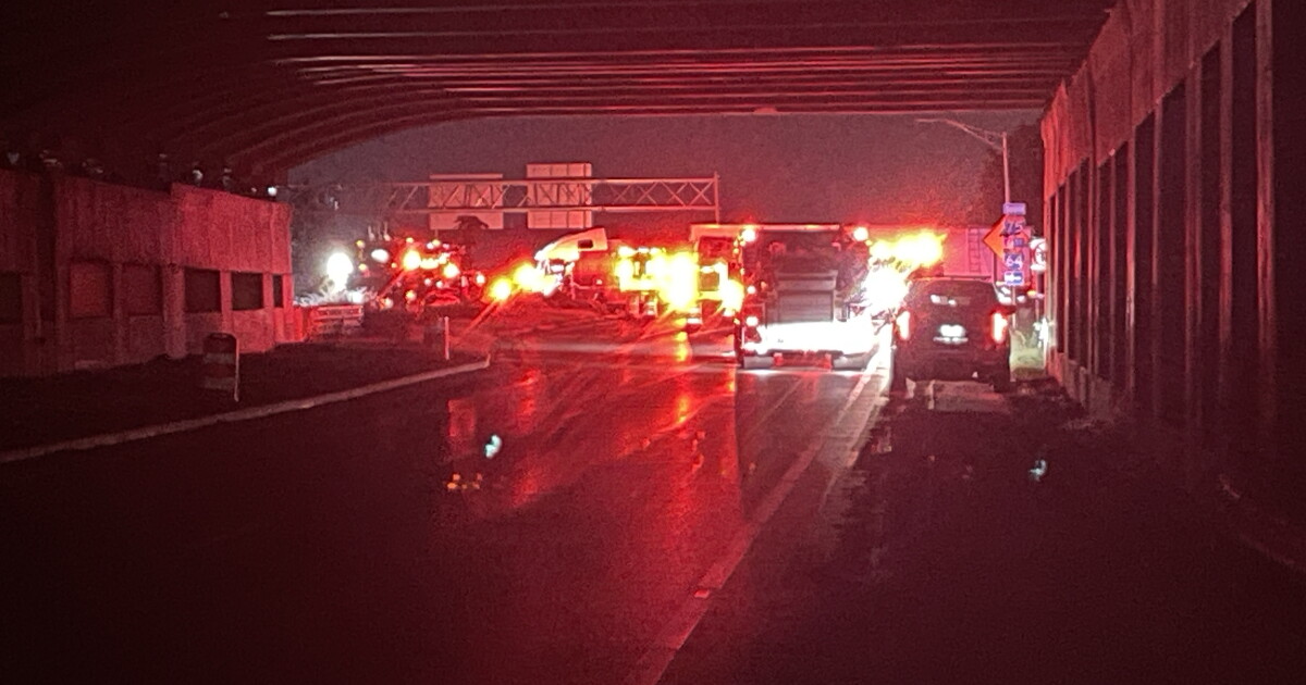 Car becomes lodged under semi-truck near Newtown Pike and I-75 in Lexington