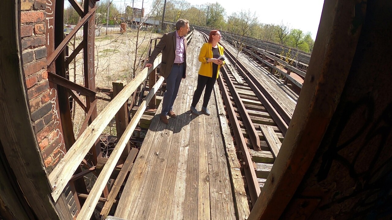 Brad Whitehead of the Cleveland site fund stands on a rail spur in the Central neighborhood.