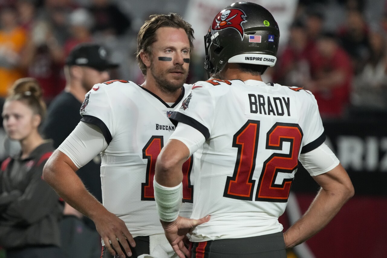 Tampa Bay Buccaneers backup QB Blaine Gabbert talks to starter Tom Brady during game at Arizona Cardinals, Dec. 25, 2022