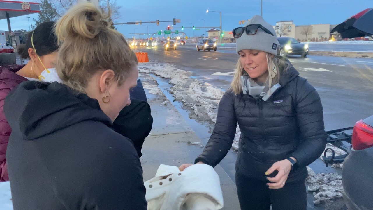 Liz Cunningham gathering clothing to distribute to neighbors in Superior who lost homes