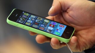 Person holds an iPhone