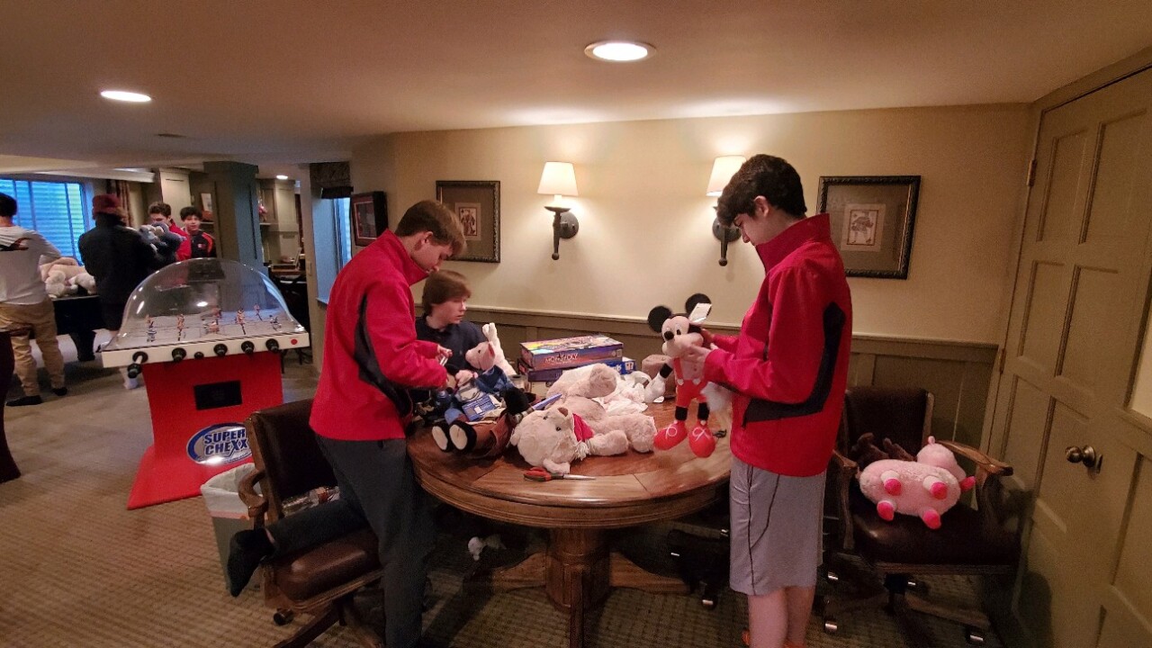 Regis Jesuit hockey - kids teddy bears.jpg