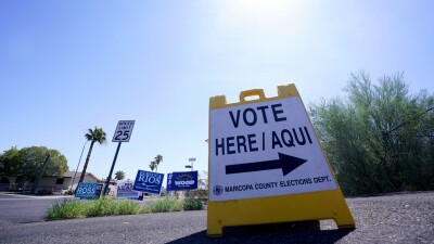 A sign indicating where to vote