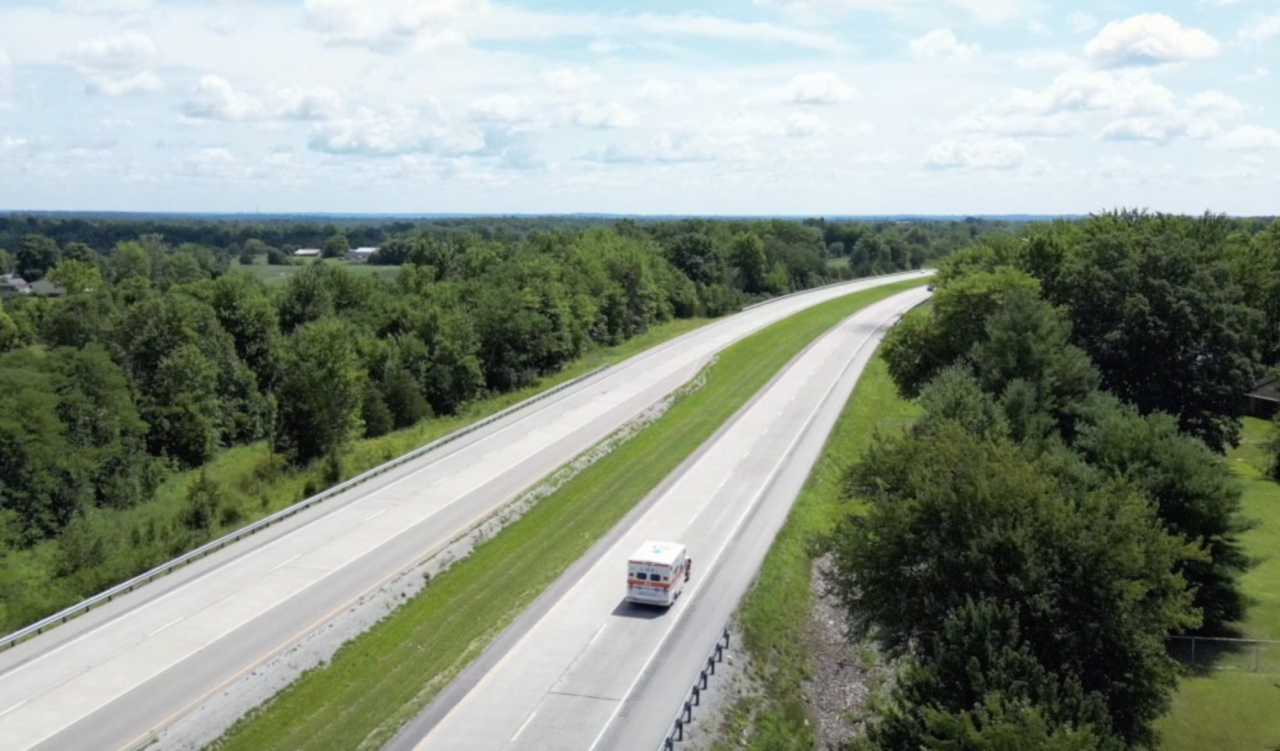 An Aurora ambulance returns from a call in Dillsboro in July 2023