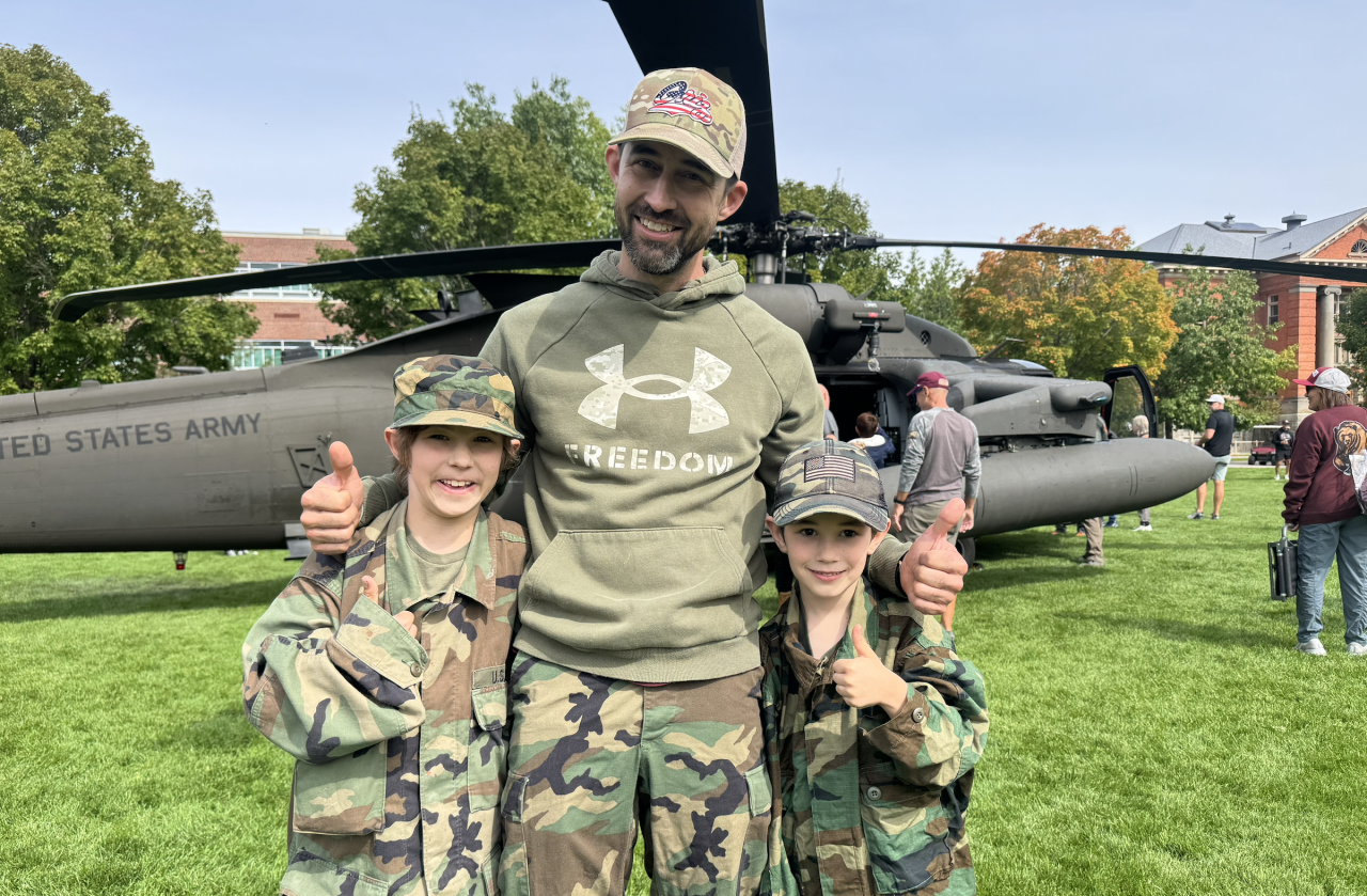 Bret Haidle enjoys UM's military appreciation day with his sons, David and Josh.
