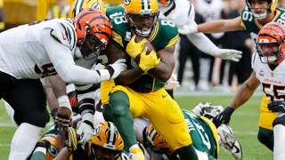 Green Bay Packers running back Josh Jacobs (8) scores a touchdown against the Cincinnati Bengals in the first half of an NFL football game, Sunday, Oct. 12, 2025, in Green Bay, Wis.