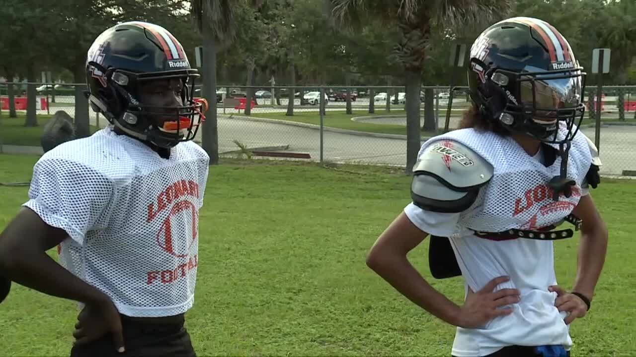 Tyrell Barr and Steven Matos, both deaf football players at John I. Leonard High School, at practice on Sept. 20, 2023.jpg