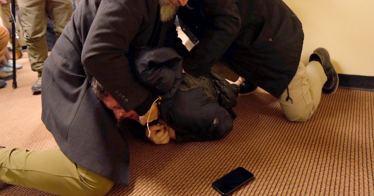 Man tackled to ground after spraying unknown substance on Rep. Ilhan Omar at Minneapolis town hall