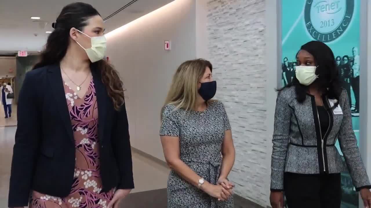 Maria Morales Menendez, Maggie Gill and Aganette Parks walk hall of Delray Medical Center