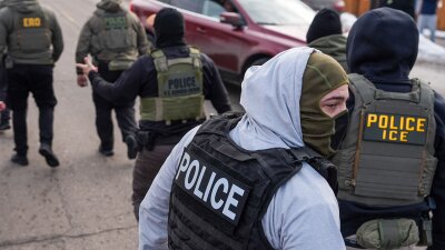 FILE - Federal agents conduct immigration enforcement operations Thursday, Feb. 5, 2026, in Minneapolis.