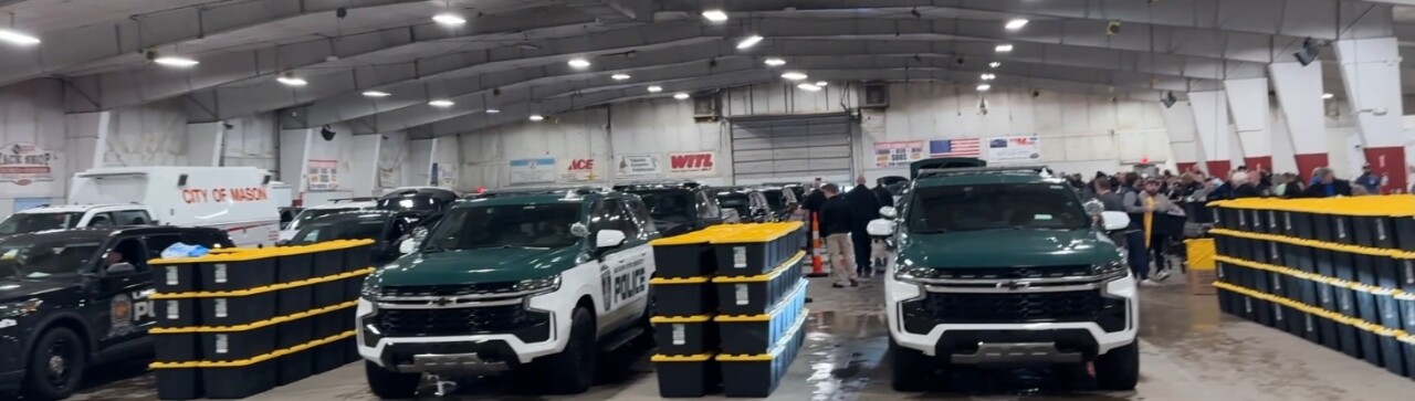 Vehicles getting loaded with large Storage Bins for Seniors.jpg
