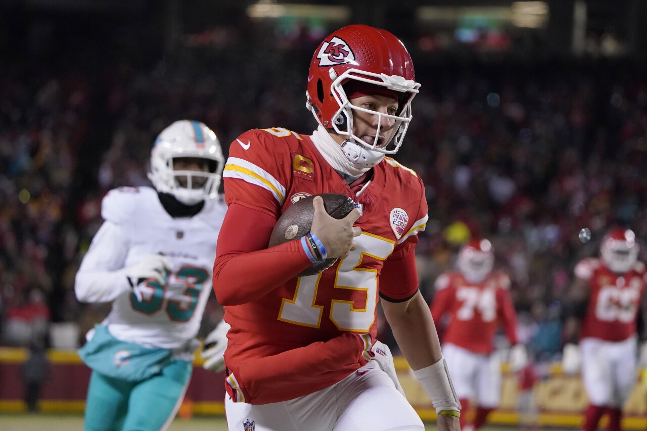 Kansas City Chiefs QB Patrick Mahomes runs for first down vs. Miami Dolphins in first half of wild-card playoff game, Jan. 13, 2023