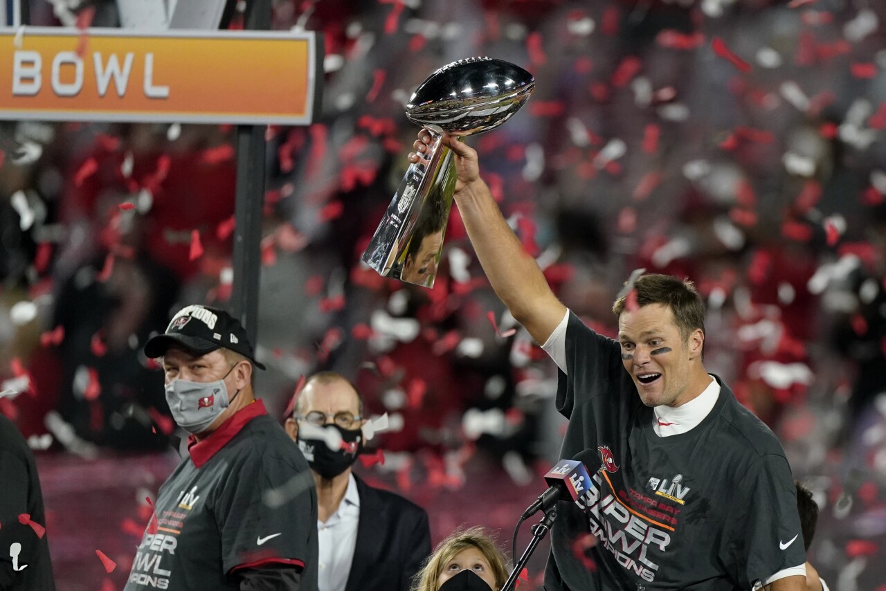 Tampa Bay Buccaneers QB Tom Brady holds Vince Lombardi Trophy after winning Super Bowl LV